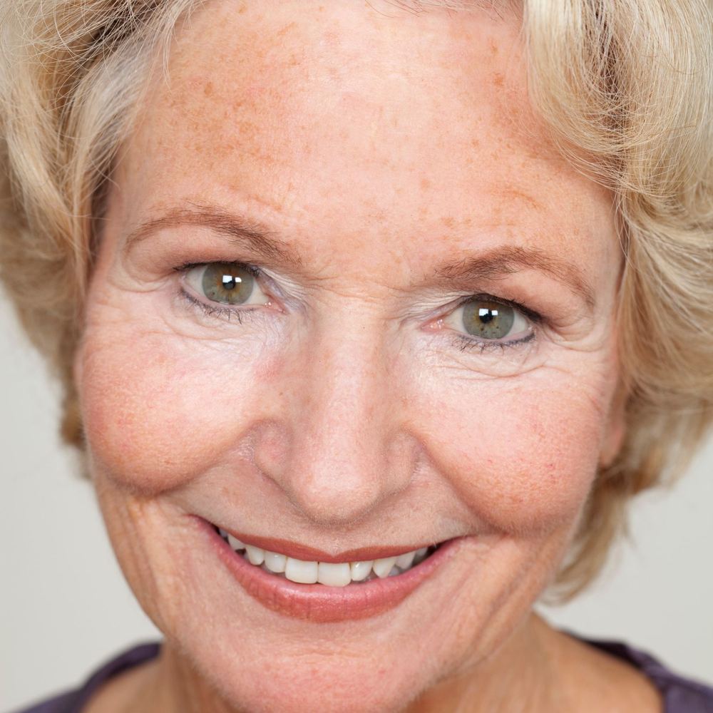 Close-up portrait of a smiling older woman